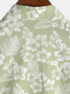 Camisa de manga corta con botones y estampado floral de algodón verde hawaiano para hombre