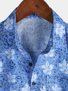 Camisa playera de algodón con estampado floral tropical de manga corta para hombre
