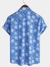 Camisa playera de algodón con estampado floral tropical de manga corta para hombre
