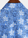 Camisa playera de algodón con estampado floral tropical de manga corta para hombre