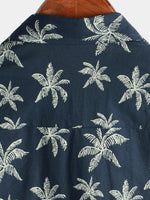 Camisa hawaiana de manga corta con botones y estampado de palmeras de algodón azul marino para hombre