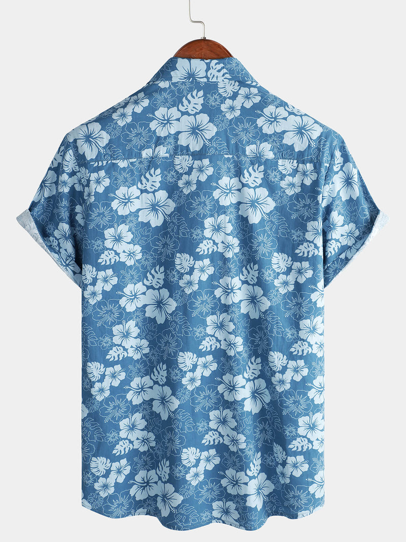 Camisa de manga corta con bolsillo y estampado floral hawaiano azul para hombre