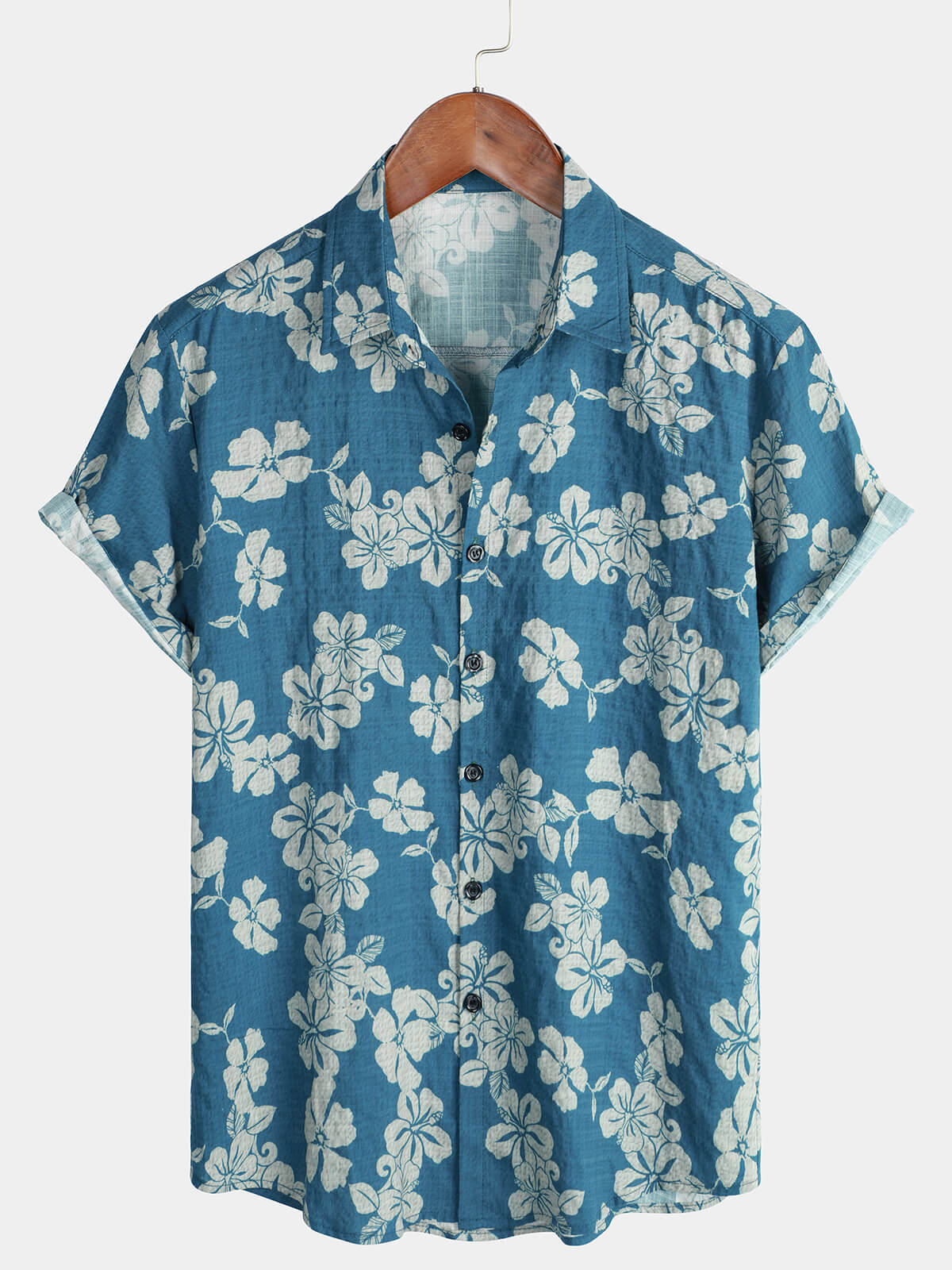 Camisa hawaiana de manga corta con botones y estampado floral festivo en color azul para hombre