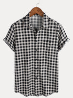 Camisa de manga corta de algodón con bolsillo y estampado de cuadros negros para hombre