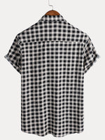 Camisa de manga corta de algodón con bolsillo y estampado de cuadros negros para hombre