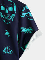 Camisa hawaiana de manga corta con botones y estampado artístico de calavera azul para hombre