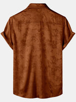 Camisa de manga corta con estampado floral de satén de seda y bolsillo en jacquard marrón para hombre