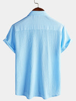 Camisa informal de manga corta con bolsillo de color liso de verano para hombre