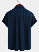 Camisa informal de manga corta con bolsillo de color liso de verano para hombre